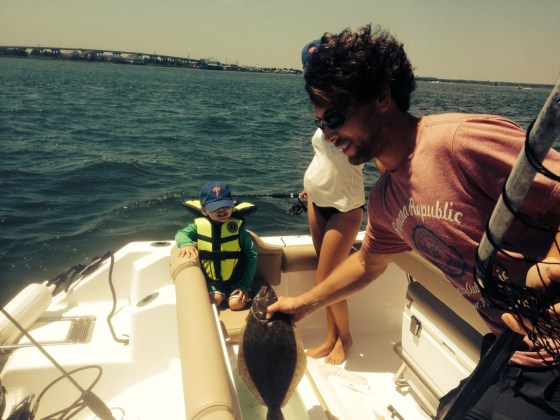 Ty McDermott checks out one of today's back bay keeper summer flounder.  